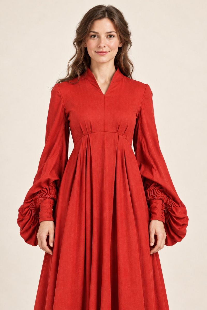 Red long-sleeve gown — closer front bodice and hip detail